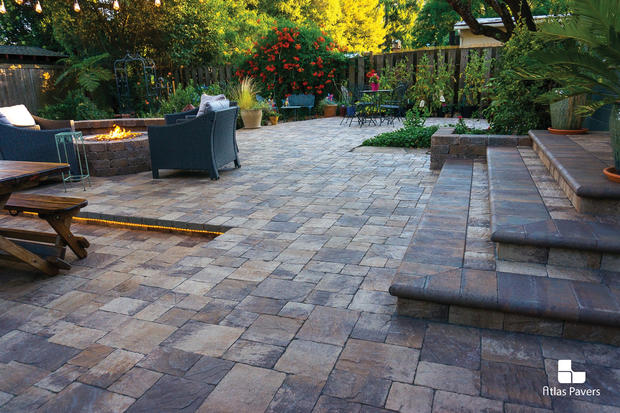 Atlas Pavers garden patio with steps and raised planting borders
